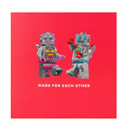 Two robot figures holding hands on a red background with 'Made for Each Other' text.