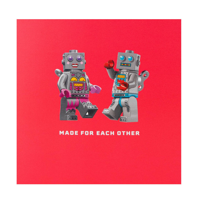 Two robot figures holding hands on a red background with 'Made for Each Other' text.