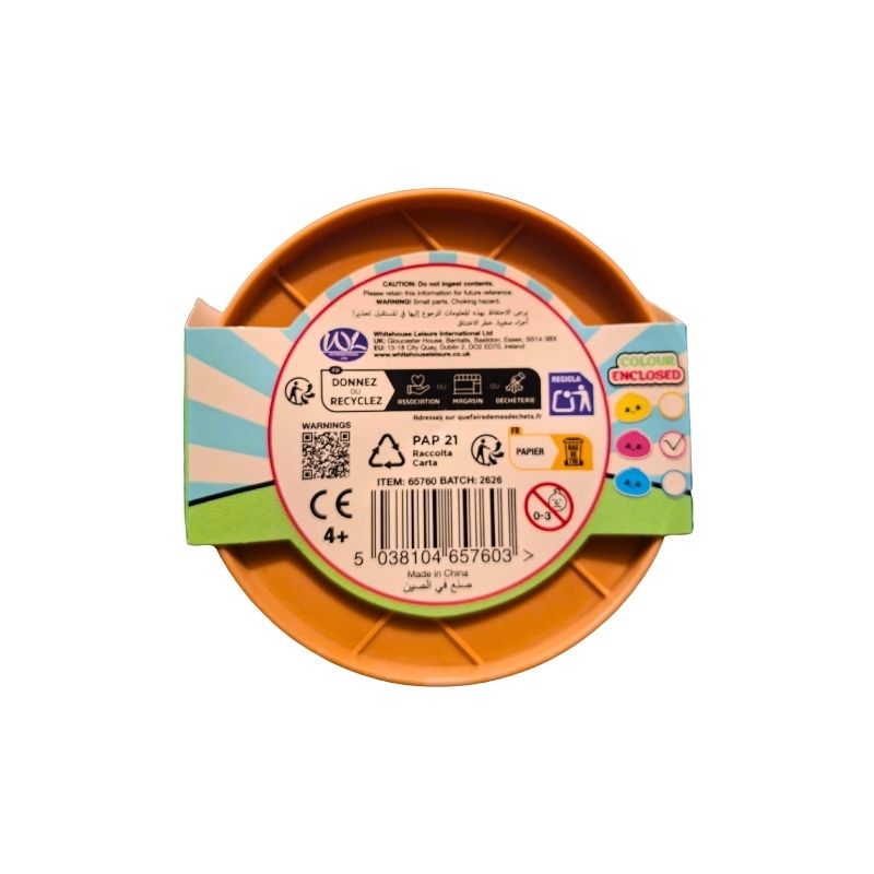 A round orange plastic item, likely a small dish or tray, shown from above with its paper packaging band wrapped around it. The packaging features a colorful design with a central white circular label containing various certification logos, barcodes, and text.