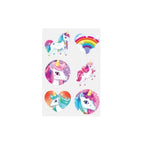A sheet of colorful unicorn-themed stickers on a light gray background, featuring white unicorns with pink, purple, and blue manes, a rainbow heart, and two circular close-up unicorn face designs.
