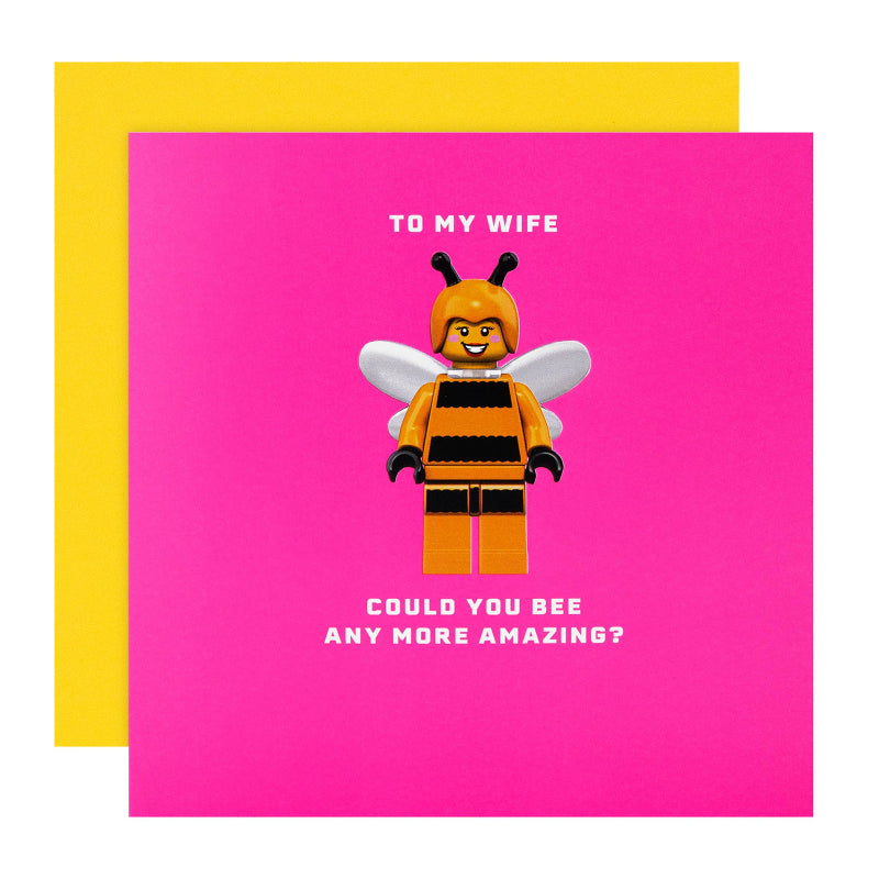 Greeting card with a bee-themed character and text on a pink background