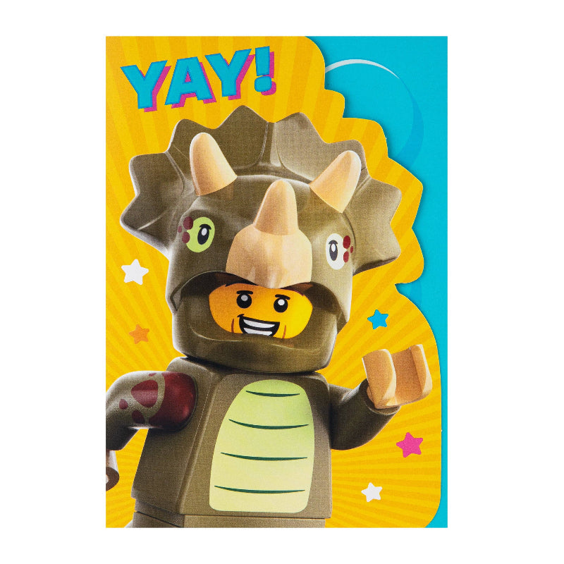 Toy figure of a dinosaur with a happy expression on a colorful background