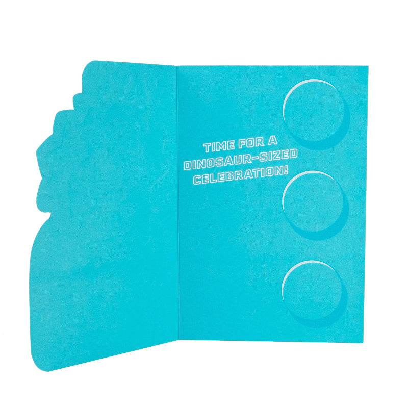 Blue card with dinosaur-shaped cutouts and text on a white background