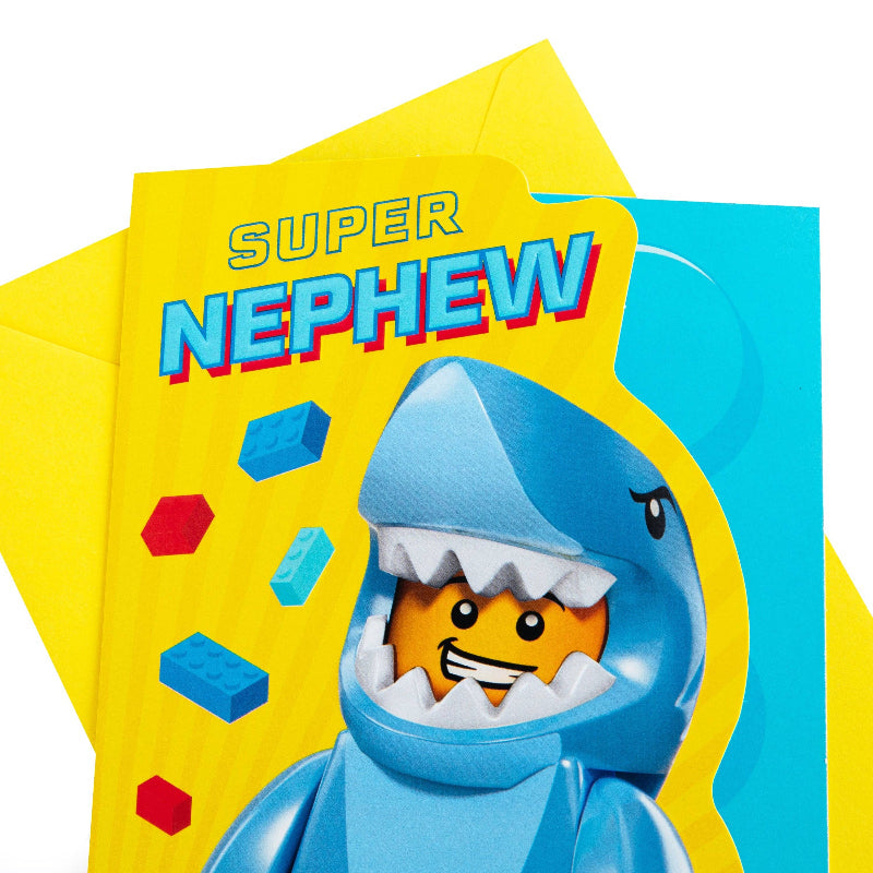 LEGO shark figure with 'Super Nephew' card on a white background