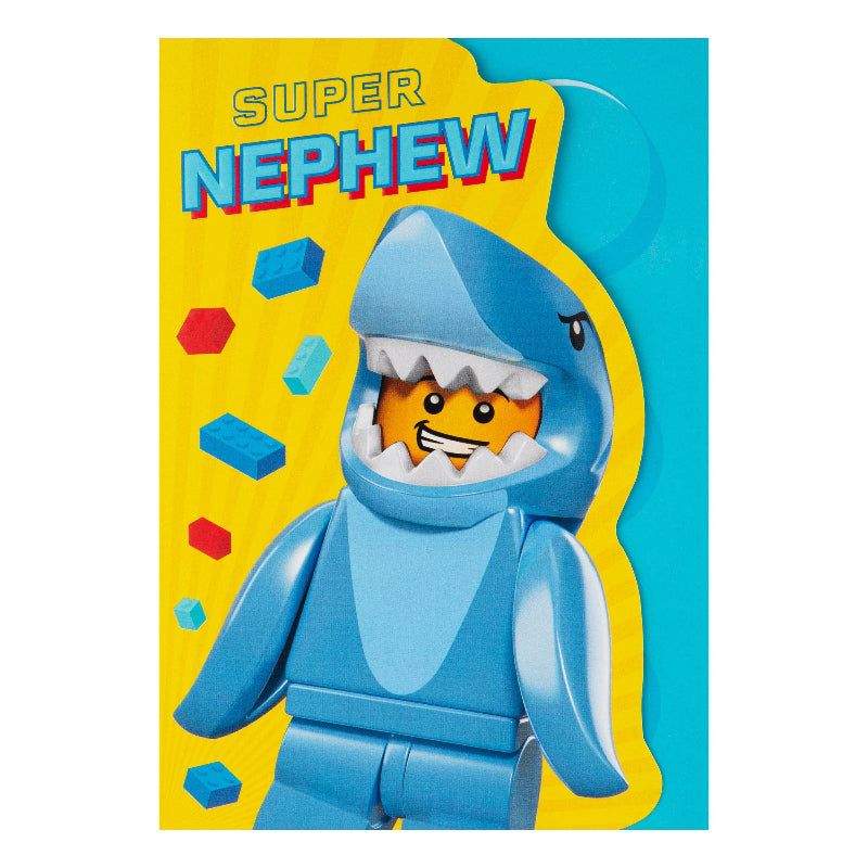 Toy figure of a shark with a smiling face on a colorful background with 'Super Nephew' text.